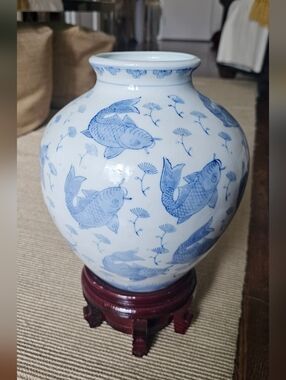 Vintage Chinese Porcelain Vase decorated with a blue and white koi fish motif